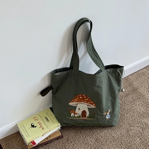 Green canvas tote bag with mushroom house embroidery and rabbit pattern for women