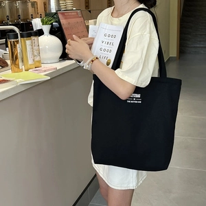 Large black canvas tote bag with ZYUBAG print for women, casual shoulder bag design
