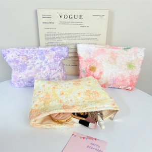 Plush floral makeup bags in purple pink and orange with large capacity storage