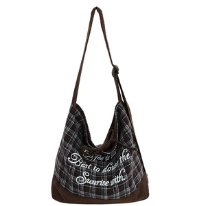 Plaid canvas shoulder bag with drawstring closure and vintage brown corduroy base