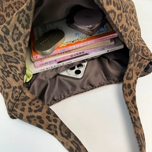 Spacious leopard print tote bag in wool fabric showing organized interior storage