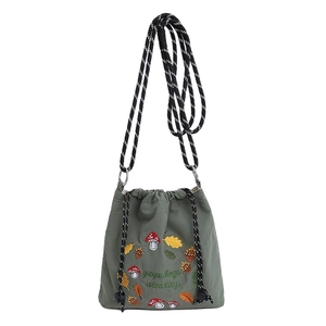 Cute nylon crossbody bucket bag in dark green featuring cartoon mushroom embroidery