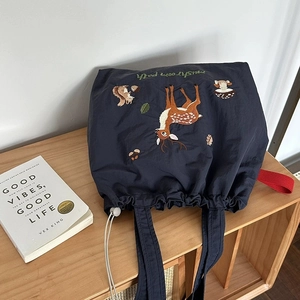 Navy blue nylon tote bag with forest animal embroidery and adjustable drawstring