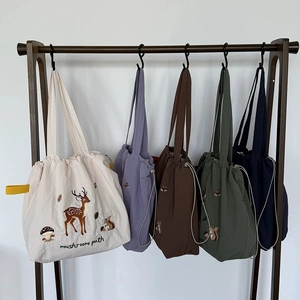 Japanese style canvas tote bag with forest animal embroidery and drawstring closure