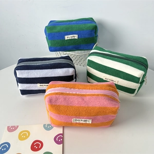 Striped fleece pencil cases in four colors with zipper and woven brand labels