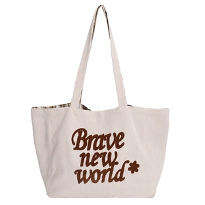 Minimalist beige corduroy tote bag with Brave New World floral embroidery detail