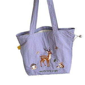 Purple canvas tote bag with forest embroidery and drawstring side detail for women