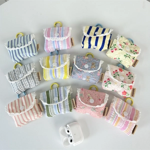 Detail of 12 patterns of pleated striped earphone cases with lace trim and metal hooks