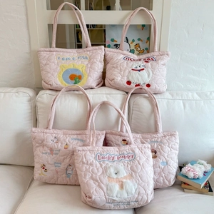 Quilted pink tote bag with cute animal embroidery featuring fish and lucky puppy designs