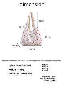 Detail view of the white strawberry tote bag showing 36x26x10cm size and internal pockets