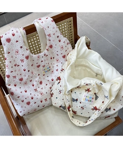 Close-up of bubble texture canvas tote bags with cute strawberry and dog prints