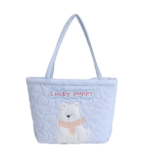 Quilted light blue tote bag with heart patterns and cute plush puppy embroidery