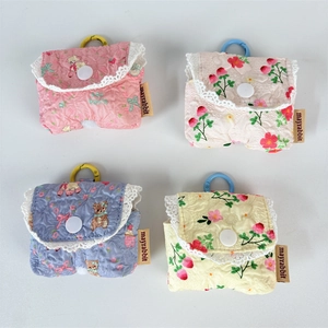 Quilted floral earphone pouches with lace edges and colorful snap hooks for storage