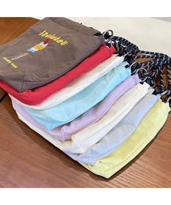 Close-up of nylon drawstring bags with ice cream embroidery in various vibrant colors