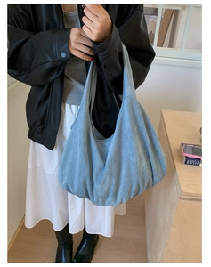 Deep blue suede large hobo tote bag shown on model for a minimalist daily commute look