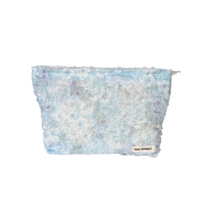 Plush tassel cosmetic bag with light blue textured fabric and large capacity storage