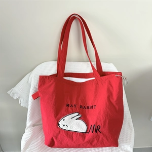 Large red nylon tote bag with white rabbit embroidery and soft wide handle