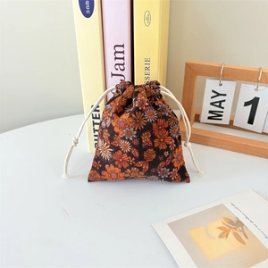 Detail of vintage floral corduroy drawstring pouch showing its soft texture and pattern