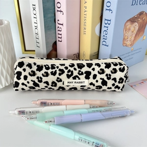 Detail of leopard print corduroy stationery bag with high-capacity and several gel pens