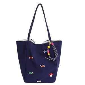 Dark blue canvas tote bag with mushroom and puppy embroidery featuring happy day slogan