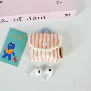 Detailed view of pink striped fabric earphone case with delicate white lace and blue hook