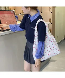 Quilted white canvas tote bag with pink strawberry and floral patterns for daily use
