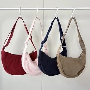 Corduroy dumpling crossbody bags in four colors with adjustable shoulder straps
