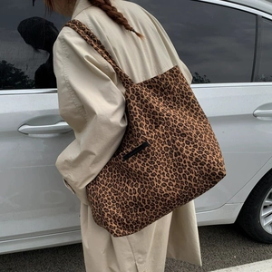 Stylish leopard print canvas tote bag for women showing a large capacity shoulder design