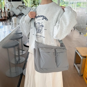 Sac bandoulière en nylon imperméable avec poches multiples et bandoulière réglable
