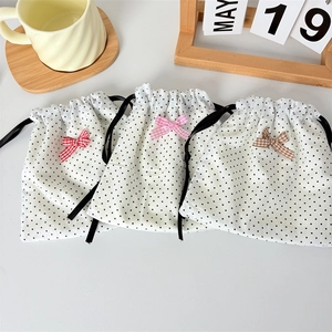 Set of three polka dot cotton drawstring bags with colorful plaid bows for jewelry