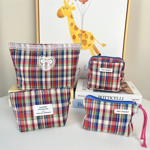 Set of four plaid makeup bags with sweet lace bow details and large storage capacity