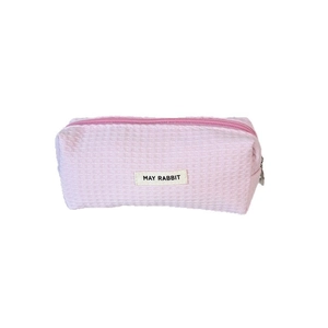 Pink waffle texture pencil case with brand label and silver metal zipper closure