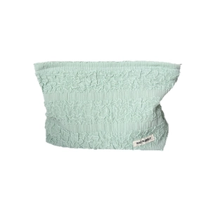 Mint green pleated texture makeup bag with a large capacity and brand label on white background
