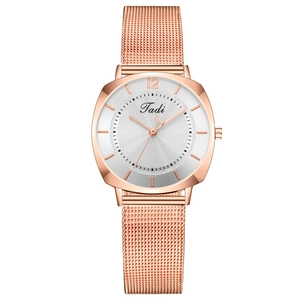 Women's rose gold watch with white dial, mesh steel strap and minimalist numeric markers