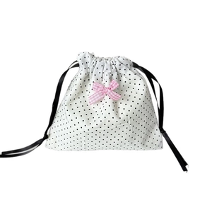 Polka dot drawstring storage bag with a sweet pink bow for jewelry and cosmetics