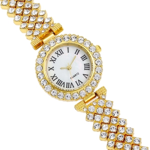 Detail of luxury gold rhinestone watch with roman numeral dial and crystal-set strap