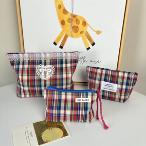 Three-piece checkered makeup bag set with white lace trim and heart-shaped applique