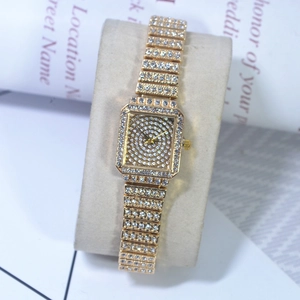 Detailed view of the square gold watch face featuring a spiral crystal pave dial
