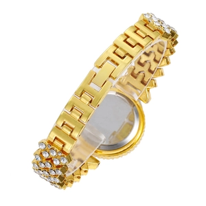Macro shot of gold-plated H-link strap with crystals and polished stainless steel case back