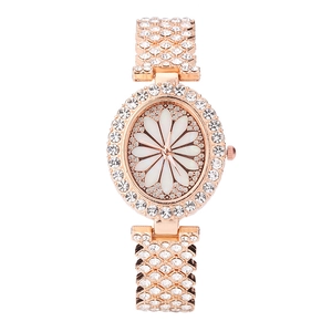 Rose gold luxury women's watch with daisy flower dial and crystal encrusted steel band