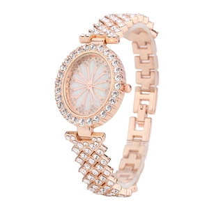 Elegant rose gold women's watch with shimmering crystal band and daisy flower dial design