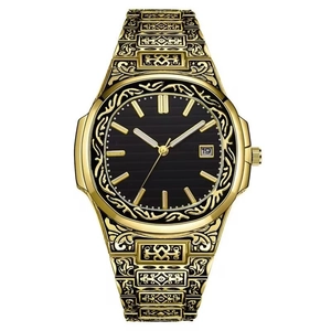 Detailed macro view of the gold-engraved floral pattern on the band and watch case