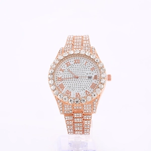 Detail of rose gold iced-out watch showing Roman numerals and a date window