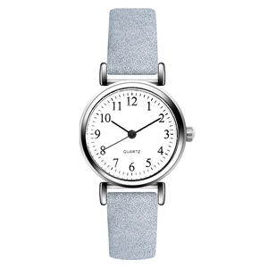 Minimalist women's quartz watch with light blue leather strap and white dial face