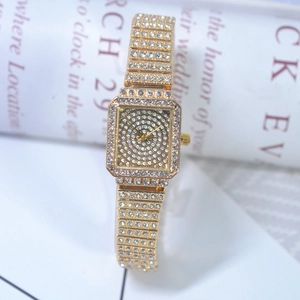 Detailed view of square gold watch with shimmering rhinestones on dial and band