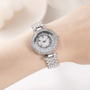 Women's silver crystal watch with flowing stones dial and sparkling diamond metal band
