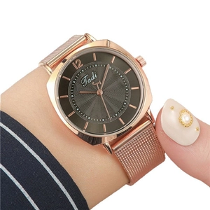 Elegant rose gold women's mesh watch with minimalist grey dial and wavy texture design