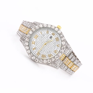 Macro shot of luxury iced-out watch with crystal bezel and Roman numeral markers