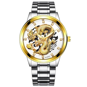 Macro view of a classic silver and gold steel watch with 3D golden dragon dial detail