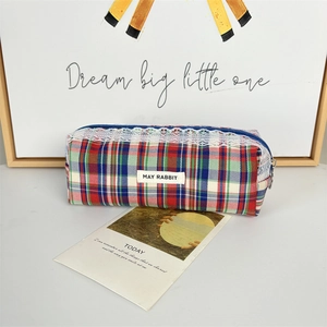 Close-up of checkered fabric makeup bag featuring white lace trim and May Rabbit label